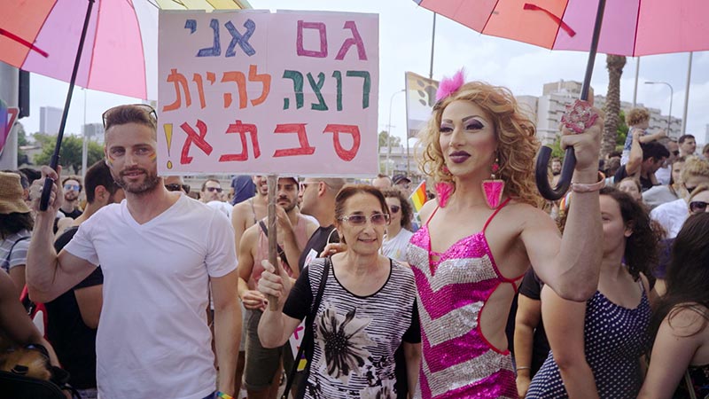 Suzi Boum with her mother and partner at a gay rights march. Photo courtesy Barak Heymann.